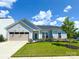 Charming single-Gathering home with a well-manicured lawn and a two-car garage on a sunny day at 11031 Larkslea Ln, Charlotte, NC 28278