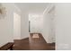 Bright entryway with hardwood floors, a bench, and an open view to the main area at 11031 Larkslea Ln, Charlotte, NC 28278