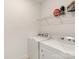 Convenient laundry area with modern, white washer and dryer units at 11031 Larkslea Ln, Charlotte, NC 28278