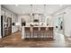 Spacious kitchen with an island and bar stool seating, featuring stainless steel appliances and ample cabinet space at 1233 Margo Mannor Dr, Fort Mill, SC 29708