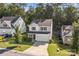 Lovely aerial view of a quaint home with a two-car garage and a combination of stone and siding at 2532 Blue Moss Dr, Dallas, NC 28034