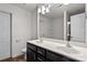 This bathroom offers a double vanity with sleek dark cabinetry, a large mirror, and modern fixtures at 2532 Blue Moss Dr, Dallas, NC 28034