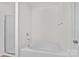 Bathroom showcasing a soaking tub and shower, designed with clean lines for a minimalist, bright space at 2532 Blue Moss Dr, Dallas, NC 28034