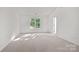 Sunlit bedroom with neutral carpet and large windows for ample natural light at 2532 Blue Moss Dr, Dallas, NC 28034