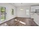 Light-filled dining area with hardwood floors and modern chandelier at 2532 Blue Moss Dr, Dallas, NC 28034