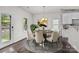 Staged dining room features modern décor, a table set for six, and lots of natural light at 2532 Blue Moss Dr, Dallas, NC 28034