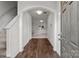 Bright foyer with wood floors and an arched entryway offering a view of the living room at 2532 Blue Moss Dr, Dallas, NC 28034