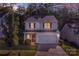 Charming two-story home with a well-manicured lawn, a two-car garage, and stone accents at 2532 Blue Moss Dr, Dallas, NC 28034