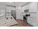 Well-lit kitchen showcases granite countertops and stainless-steel appliances at 2532 Blue Moss Dr, Dallas, NC 28034
