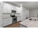 Beautiful kitchen with white cabinets, stainless steel appliances, and granite countertops at 2532 Blue Moss Dr, Dallas, NC 28034