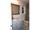 Bathroom featuring marble countertops, tile floors and marble shower at 258 Lincoln Sw St, Concord, NC 28025