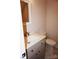 A bathroom has a vanity with marble countertop, toilet, and neutral paint at 258 Lincoln Sw St, Concord, NC 28025