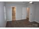 Bedroom featuring wood-look floors, neutral paint and view of bathroom at 258 Lincoln Sw St, Concord, NC 28025