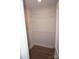 Walk-in closet featuring wire shelving and wood-look flooring at 258 Lincoln Sw St, Concord, NC 28025