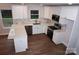 Well-appointed kitchen with white cabinets, stainless steel appliances, and a stylish island at 258 Lincoln Sw St, Concord, NC 28025