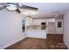 Open-concept kitchen featuring white cabinets, quartz countertops, and stainless steel appliances at 258 Lincoln Sw St, Concord, NC 28025