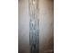 Marble-style tile in a bathroom with a decorative strip of glass and gray accent tiles at 258 Lincoln Sw St, Concord, NC 28025