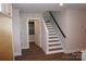 A staircase with white risers and wood treads connects the home's levels at 258 Lincoln Sw St, Concord, NC 28025