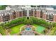 Aerial view of a residential apartment complex featuring lush landscaping and a central fountain at 300 W 5Th St # 617, Charlotte, NC 28202