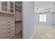 Bedroom with custom built-in closet and storage at 300 W 5Th St # 617, Charlotte, NC 28202