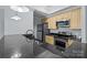 Well-equipped kitchen with stainless steel appliances, granite countertops, and stylish lighting at 300 W 5Th St # 617, Charlotte, NC 28202