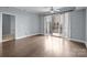 Well-lit living room with hardwood floors, a balcony overlooking the cityscape, and neutral walls at 300 W 5Th St # 617, Charlotte, NC 28202