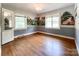 Cozy bedroom featuring hardwood floors, hand painted wall murals, and a decorative chandelier at 310 E Houston St, Monroe, NC 28112