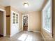 Sunny dining area featuring tile floors, natural light, and a charming built-in cabinet at 310 E Houston St, Monroe, NC 28112