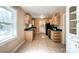 Practical kitchen with tile floors, natural light, and ample cabinet space at 310 E Houston St, Monroe, NC 28112
