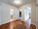 Spacious room with hardwood floors and doorways leading to the bathroom, library, and bedroom at 310 E Houston St, Monroe, NC 28112
