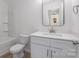 Bright bathroom with a white vanity, large mirror, and a combination shower and bathtub at 318 Sixth St, Belmont, NC 28012