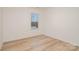 Cozy bedroom with a large window and wood-look flooring at 318 Sixth St, Belmont, NC 28012