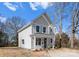 Well-maintained home with a cozy porch, showcasing its architectural style and curb appeal at 318 Sixth St, Belmont, NC 28012