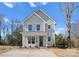 Beautiful home featuring a classic design, manicured lawn, and an inviting entrance at 318 Sixth St, Belmont, NC 28012