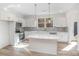 Modern kitchen with stainless steel appliances, white cabinets, and a spacious center island at 318 Sixth St, Belmont, NC 28012