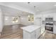 Open concept kitchen and living room featuring stainless appliances and center island with seating at 318 Sixth St, Belmont, NC 28012