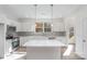 Modern kitchen with stainless steel appliances, white cabinets, and a spacious center island at 318 Sixth St, Belmont, NC 28012