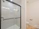 Bathroom with a large glass-enclosed shower featuring a shower head and modern fixtures at 318 Sixth St, Belmont, NC 28012