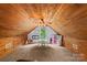 Finished attic space with wood ceiling perfect for a playroom or additional storage at 360 Lake Landing Dr, Salisbury, NC 28146