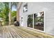 Wooden deck with a grill and sliding doors to the house with water view, set against siding exterior at 360 Lake Landing Dr, Salisbury, NC 28146