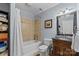 Well-lit bathroom with a shower-tub combo, vanity, and updated fixtures at 360 Lake Landing Dr, Salisbury, NC 28146