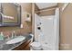 Bathroom featuring a walk-in shower, modern vanity, and neutral color scheme at 360 Lake Landing Dr, Salisbury, NC 28146