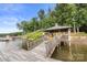 Wooden dock features a covered sitting area, stairs to land, and lake access at 360 Lake Landing Dr, Salisbury, NC 28146