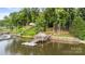 Stunning lake house featuring a private dock with gazebo and lush green surroundings at 360 Lake Landing Dr, Salisbury, NC 28146