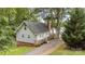 Charming exterior view of a house with a deck overlooking water, set among lush trees at 360 Lake Landing Dr, Salisbury, NC 28146