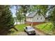 Exterior of a house with two-story deck, lake view and a truck parked in the driveway at 360 Lake Landing Dr, Salisbury, NC 28146