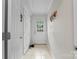 Bright hallway featuring neutral tile flooring and access to other rooms at 360 Lake Landing Dr, Salisbury, NC 28146