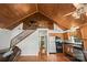 Eat-in kitchen with wood ceiling, cabinetry and appliances adjacent to the living area at 360 Lake Landing Dr, Salisbury, NC 28146