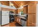 Close-up of kitchen featuring stainless steel appliances, wood cabinets, and countertops at 360 Lake Landing Dr, Salisbury, NC 28146