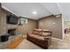 Cozy living room features a leather sofa and a fireplace, ideal for relaxation at 360 Lake Landing Dr, Salisbury, NC 28146